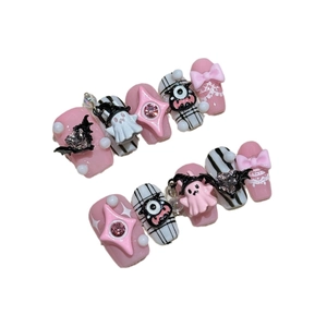Handmade Halloween press-on nails featuring pink and black ghost and bat designs