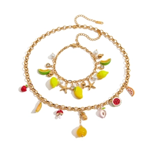 Luxurious gold stainless steel jewelry set with colorful enamel fruit charms and pearls