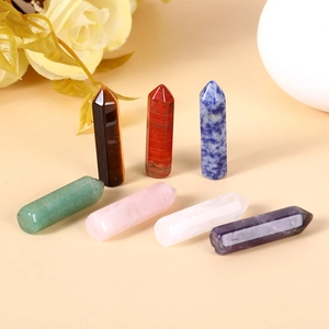 Set of 7 natural crystal hexagonal pillars including amethyst rose quartz and tiger eye