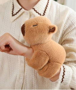 Plush Capybara slap bracelet accessory featuring soft brown fur on a person's wrist