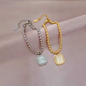Armband aus Titanstahl mit quadratischem Katzenaugen-Stein in Gold und Silber