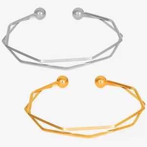 Detailed view of silver and gold 18K plated stainless steel open geometric bracelets