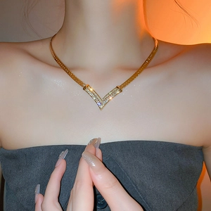 Elegant gold plated V-shaped diamond pendant necklace with chic snake chain for women