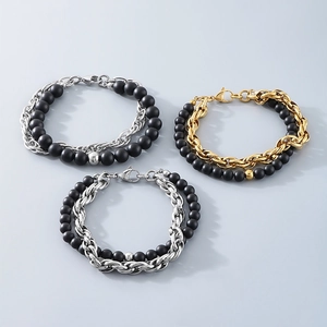 Detail of double-layer black onyx bead and twisted titanium steel chain bracelet for men