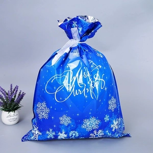 Blauer Weihnachtsbeutel mit Kordelzug, weißen Schneeflocken und Merry Christmas Aufdruck