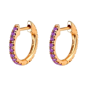 Detailed macro view of 14K gold hoop earrings with purple round-cut cubic zirconia stones
