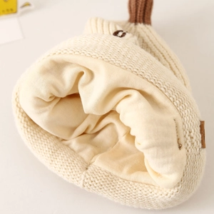 Winter knitted baby hat with lucky bear embroidery and soft thermal lining for warmth
