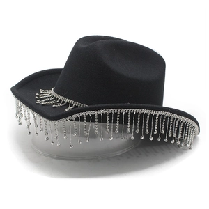 Close-up of black felt cowboy hat with sparkling long rhinestone fringe and crystal tassels