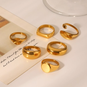 Set of six polished 18K gold stainless steel rings in various minimalist geometric designs
