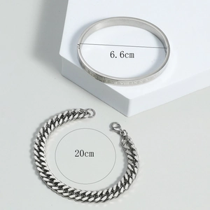 Detail view of silver titanium steel bangle and Cuban chain bracelet with dimensions