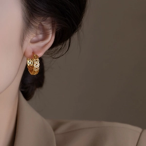 Gold plated round coin earrings with cubic zirconia in a modern Chinese retro style