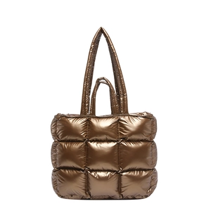 Bronze metallic puffer tote bag with large quilted stitching and dual shoulder straps