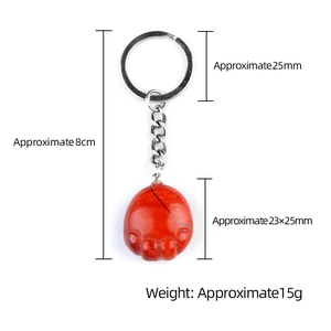 Red agate cat paw keychain with silver metal ring showing full dimensions and weight