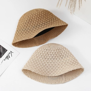 Stylish women's hollow-out knitted bucket hats for sun protection in beige and tan colors