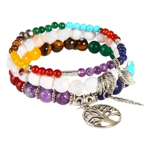 Detailed view of bohemian multi-layer beads with Tree of Life and feather pendants