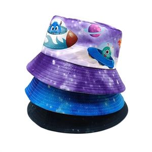 Close-up of kids' bucket hats with cartoon spaceship and starry night patterns