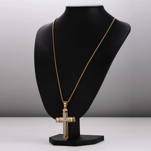 Two-tone stainless steel cross pendant necklace on a black mannequin display