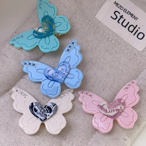 Chic butterfly hair clips with LOVE heart charms and crystals in four soft pastel colors