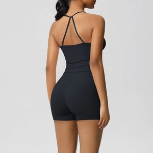 Detailed back view of a black two-piece yoga set with cross-strap vest and high-waisted shorts