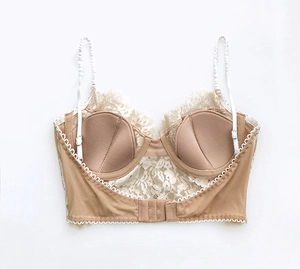 Detailed back view of lace bralette with hook-and-eye closure in beige finish