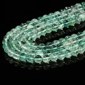 Natural green fluorite round beads bracelet with translucent texture on black background