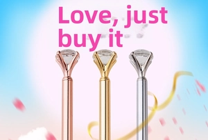 Close-up of three metal ballpoint pens in rose gold, gold and silver with large crystals