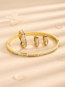 Set di gioielli in acciaio al titanio dorato con bracciale anello e orecchini in zircone