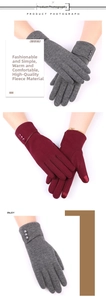 Detail view of fleece lining winter gloves for women with touchscreen tips and decorative buttons