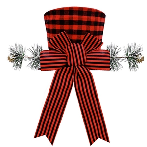 Detail of red and black buffalo plaid Christmas tree topper hat with bow and pine needles