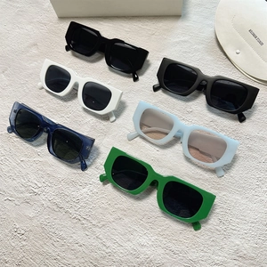 Detailed collection of rectangle sunglasses in multiple colors on a textured background