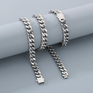Detailed close-up of polished silver Miami Cuban link necklace with visible buckle clasp