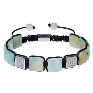 Detail of woven bracelet with green square stone and adjustable black cord closure