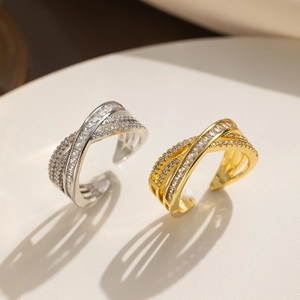 Close-up of double-layer crisscross rings with sparkling micro-pave cubic zirconia