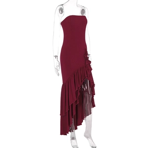 Detailed view of the asymmetrical ruffle hemline on a wine red strapless bodycon dress