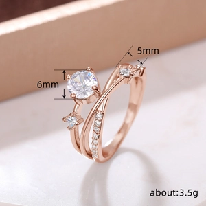Elegante roségouden planeetring met 6mm ronde zirkoon en zijstenen van pavé