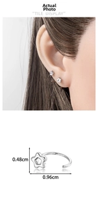 Detail of silver star C-shaped stud earrings showing dimensions 0.48cm by 0.96cm