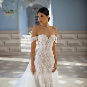 Elegant white lace off-shoulder mermaid wedding dress with floral embroidery and long train