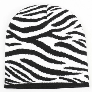 Close-up of zebra pattern knitted beanie showing high-density texture and warm material