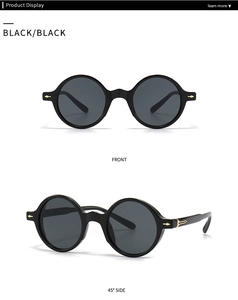 Gros plan sur lunettes de soleil rondes noires rétro avec détails flèche dorée