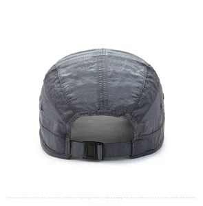 Detail view of the adjustable buckle strap and ripstop fabric on a dark grey sports cap