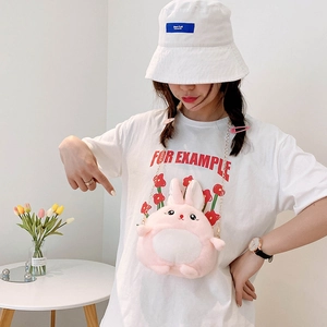 Pink plush rabbit crossbody bag with gold chain strap shown on a young girl model