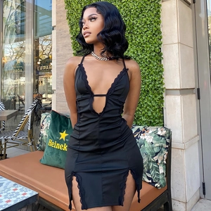Detailed close-up of delicate black lace trim and side slit on this sexy bodycon dress