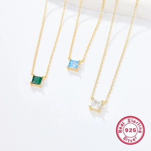 Detail of S925 sterling silver necklaces with emerald, sky blue, and white square zircon