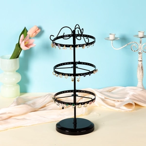 Rotatable black metal earring organizer rack with three tiers for jewelry storage