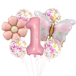 Detail of pink number one balloon with butterfly and flower for first birthday decor