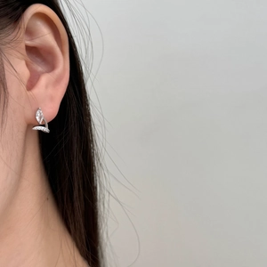 Close-up of S925 sterling silver stud earring with marquise zircon on ear