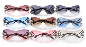 Detailed macro view of rimless Y2K sunglasses in nine assorted gradient lens colors