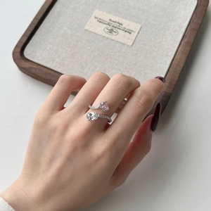 Detailed close-up of S925 silver ring featuring pink heart and pear-shaped stones