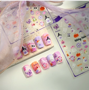 Detail of KX486 Halloween nail stickers with cute ghosts and pumpkins on purple gradient