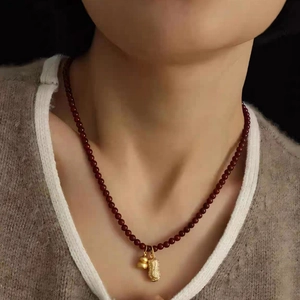Vintage 18k gold plated peanut and gourd pendant necklace with dark red beads
